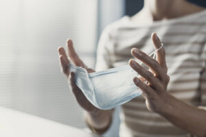 Woman wearing a protective surgical mask